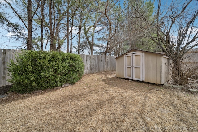 view of shed with a fenced backyard