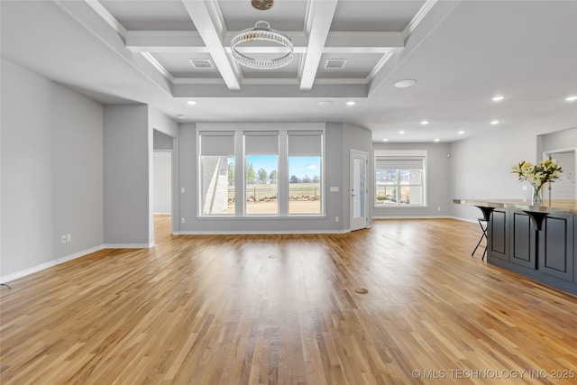 unfurnished living room with recessed lighting, beam ceiling, coffered ceiling, and light wood finished floors