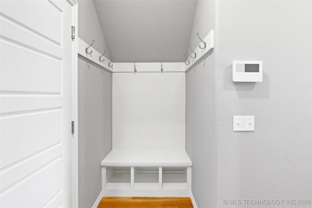 mudroom with light wood-style floors and baseboards