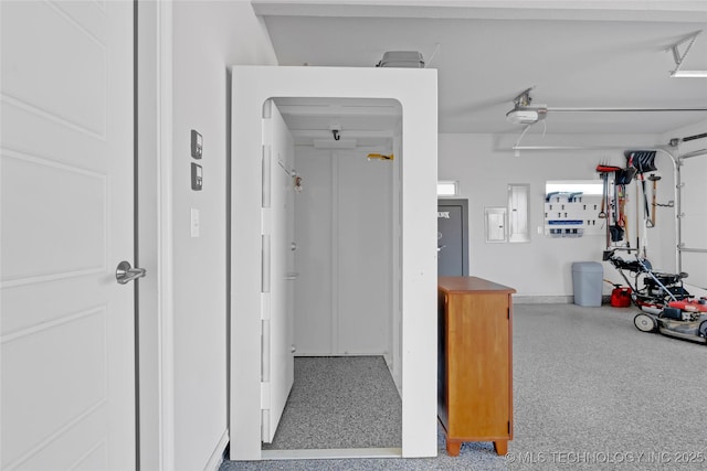 hall featuring speckled floor