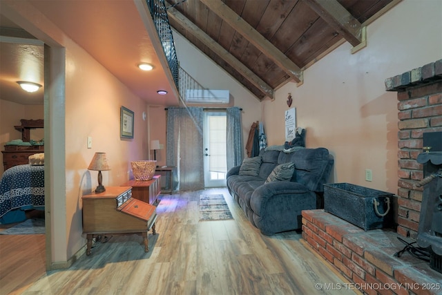 living area featuring wood ceiling, wood finished floors, vaulted ceiling with beams, and a wall unit AC