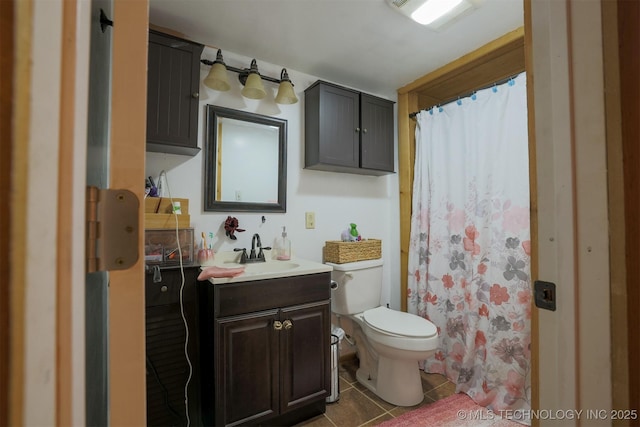 full bath with tile patterned flooring, toilet, vanity, and a shower with shower curtain