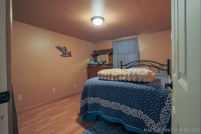 bedroom with light wood-style flooring