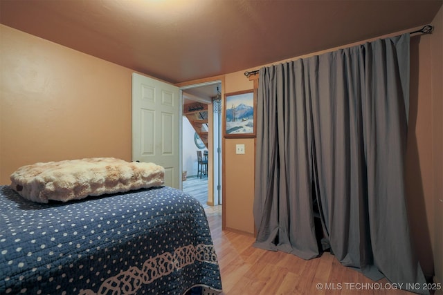 bedroom featuring light wood finished floors