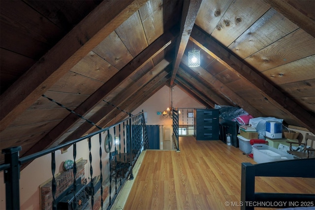 attic featuring an upstairs landing