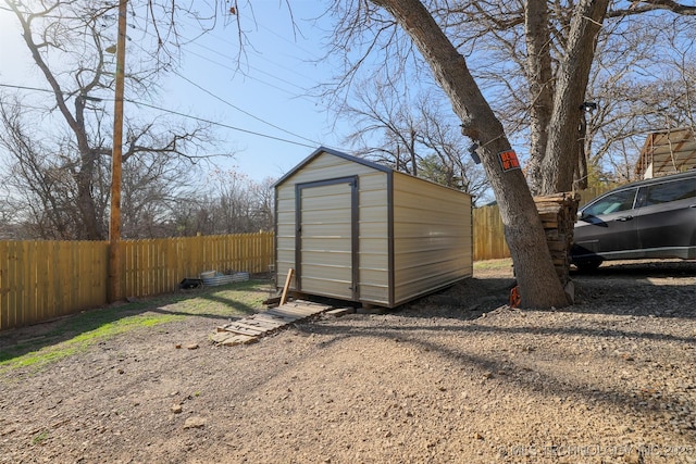 view of shed featuring a fenced backyard