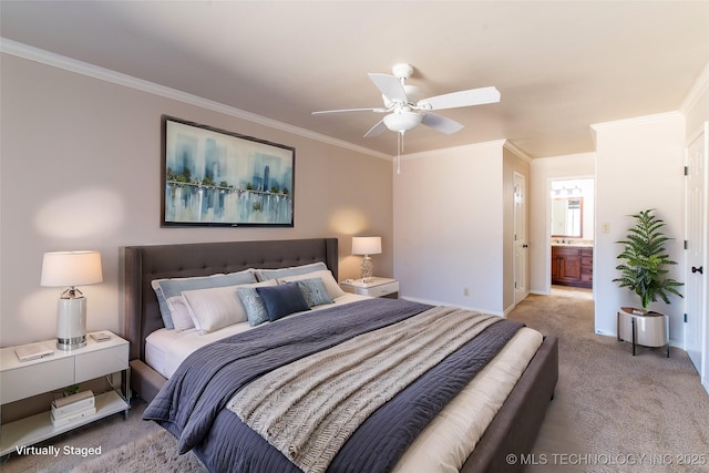 carpeted bedroom with ceiling fan, connected bathroom, baseboards, and ornamental molding