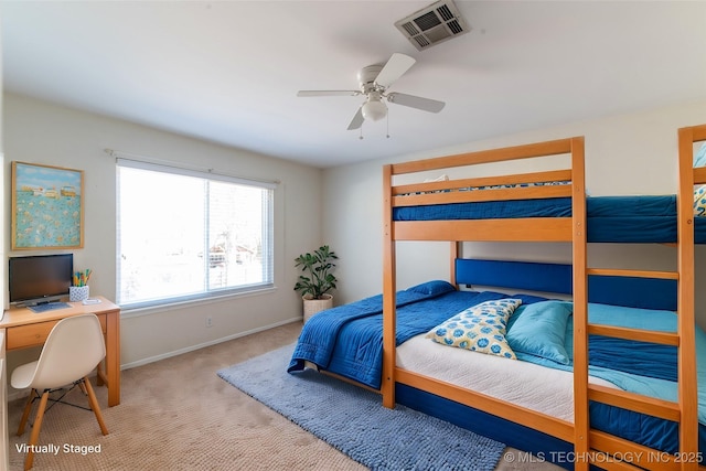 carpeted bedroom featuring visible vents, ceiling fan, and baseboards