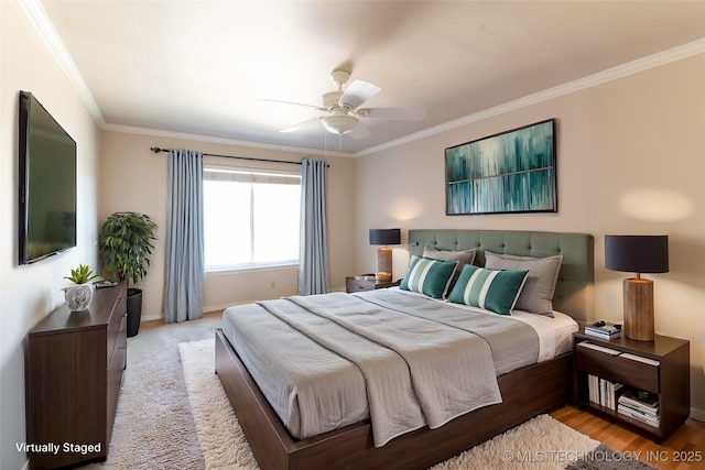 bedroom featuring ceiling fan, baseboards, and ornamental molding