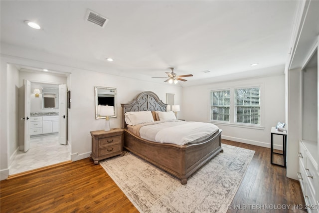 bedroom with recessed lighting, wood finished floors, visible vents, and baseboards