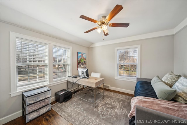 office area with vaulted ceiling, wood finished floors, baseboards, and a wealth of natural light