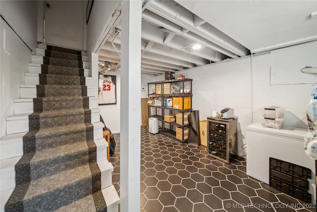 finished basement with stairway and wine cooler