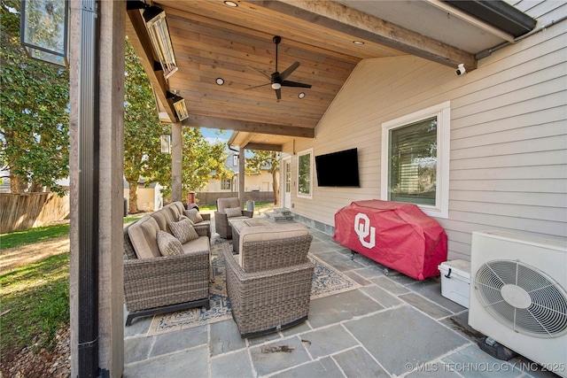 view of patio with outdoor lounge area, ac unit, fence, and ceiling fan