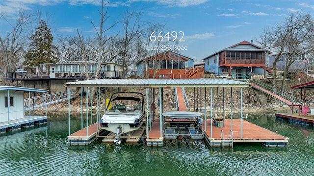 view of dock featuring boat lift and a water view