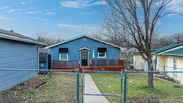 view of front of house with a front yard, a gate, and a fenced front yard