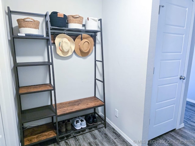 mudroom featuring wood finished floors and baseboards