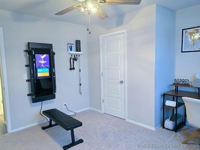 workout area with baseboards, carpet, and ceiling fan