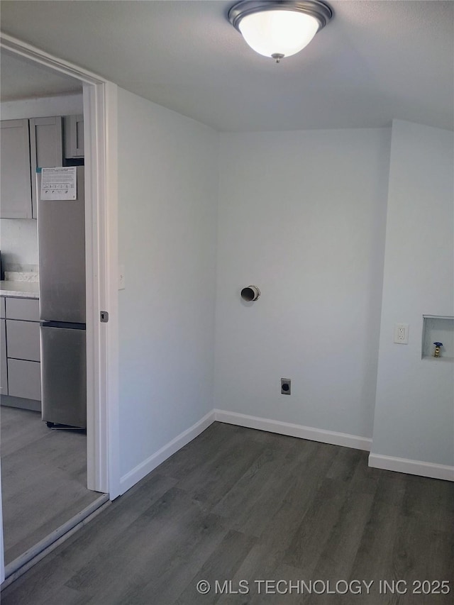 washroom featuring baseboards, laundry area, dark wood-style flooring, electric dryer hookup, and washer hookup