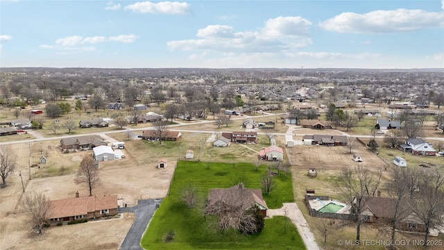 birds eye view of property with a residential view