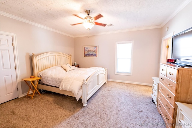 bedroom with visible vents, light colored carpet, baseboards, and ornamental molding