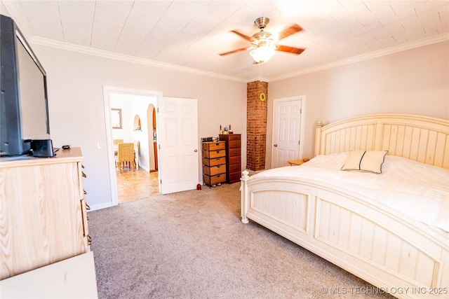 bedroom with light colored carpet, arched walkways, and ornamental molding