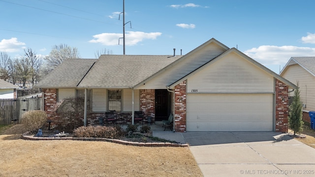 ranch-style home featuring a garage, brick siding, concrete driveway, and fence