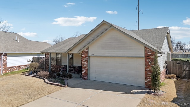 single story home featuring brick siding, driveway, a shingled roof, and a garage