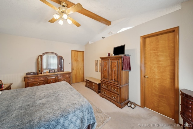 bedroom with lofted ceiling with beams, light carpet, and a ceiling fan