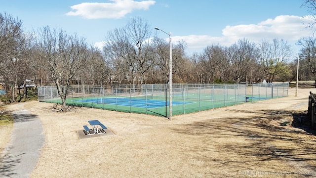 view of sport court with fence