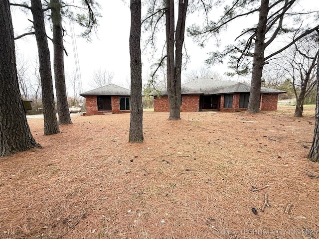 exterior space featuring brick siding