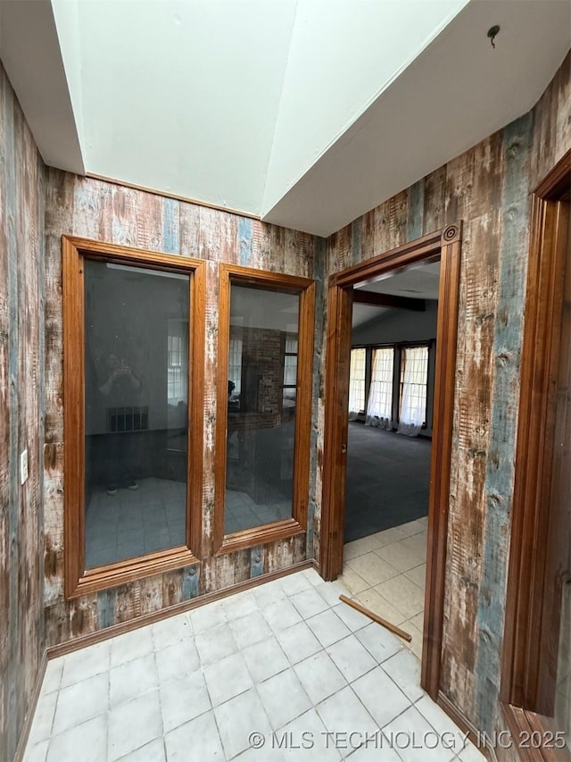 interior space featuring lofted ceiling and visible vents