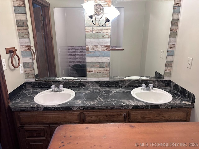 full bath featuring double vanity and a sink