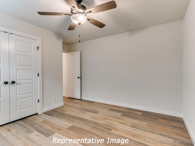 unfurnished bedroom with light wood-type flooring, baseboards, a closet, and ceiling fan