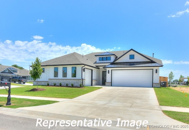 view of front of house featuring driveway, an attached garage, a front lawn, and a shingled roof