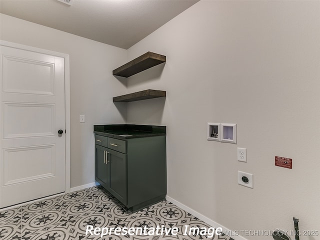 laundry area featuring washer hookup, cabinet space, light tile patterned flooring, baseboards, and hookup for an electric dryer