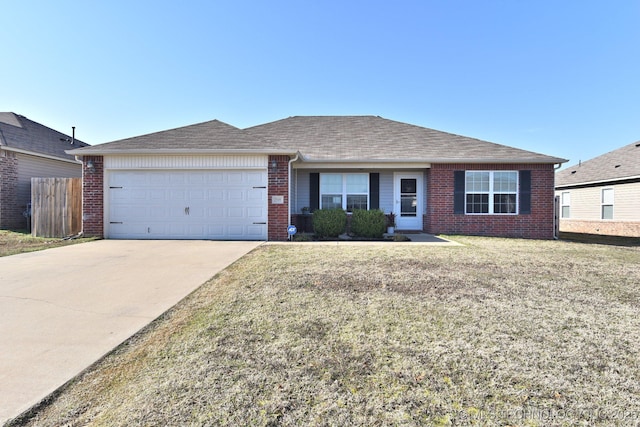 single story home featuring brick siding, driveway, a front lawn, and a garage