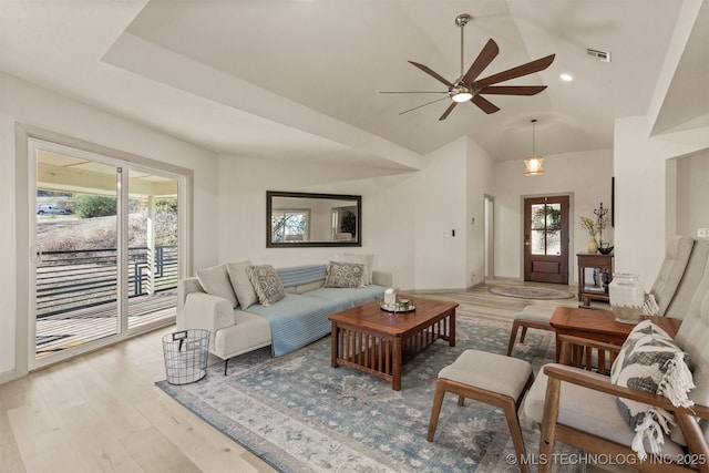 living area featuring visible vents, a ceiling fan, recessed lighting, light wood-style floors, and lofted ceiling