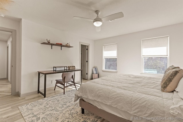 bedroom with ceiling fan and wood finished floors