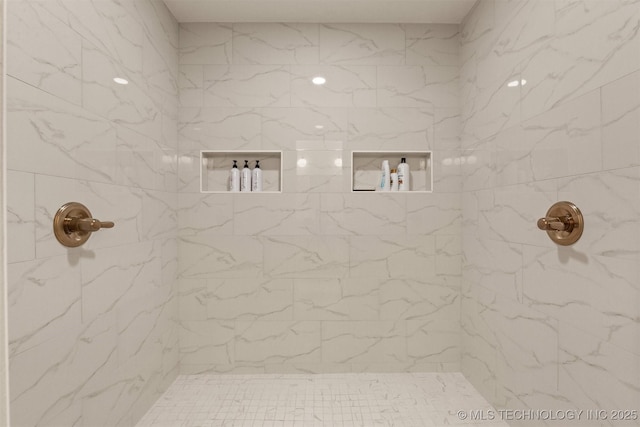 full bath with a marble finish shower