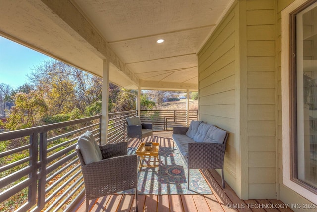 wooden deck with outdoor lounge area