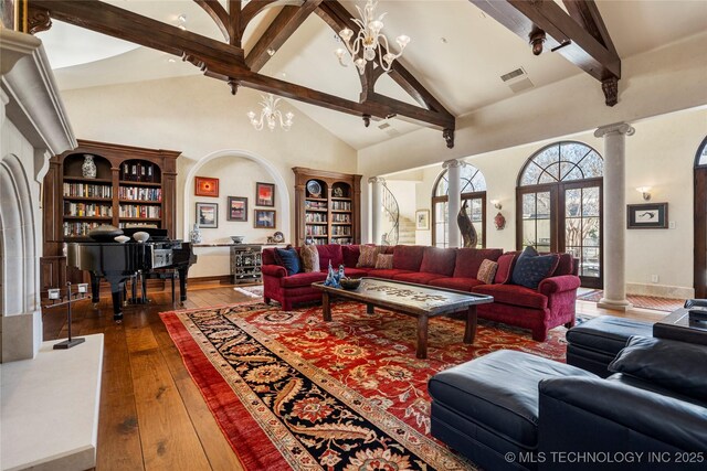 3217 E 61st Pl, Tulsa, OK 74136 - living area featuring beamed ceiling, visible vents, high vaulted ceiling, and hardwood / wood-style flooring