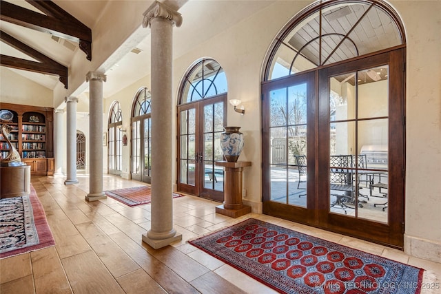 3217 E 61st Pl, Tulsa, OK 74136 - entryway with beam ceiling, ornate columns, french doors, and high vaulted ceiling