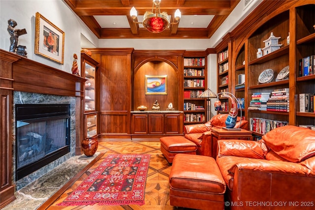 3217 E 61st Pl, Tulsa, OK 74136 - sitting room featuring beam ceiling, ornamental molding, a notable chandelier, and a premium fireplace