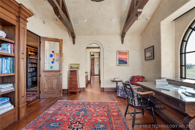 3217 E 61st Pl, Tulsa, OK 74136 - office space with dark wood-style floors, arched walkways, beam ceiling, and baseboards