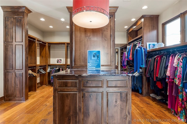 3217 E 61st Pl, Tulsa, OK 74136 - walk in closet featuring light wood finished floors