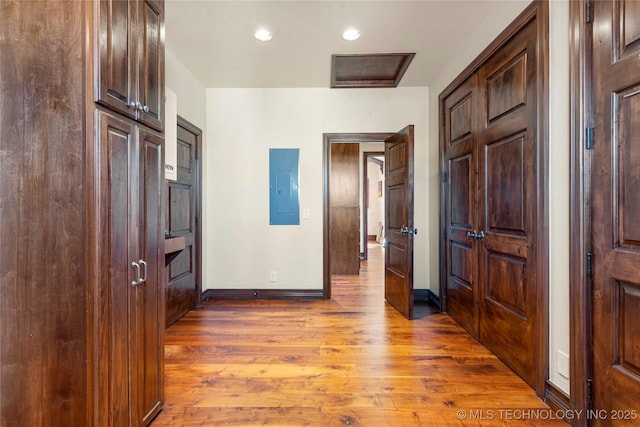 3217 E 61st Pl, Tulsa, OK 74136 - corridor featuring recessed lighting, electric panel, wood finished floors, and baseboards