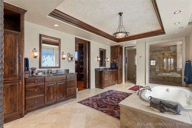 3217 E 61st Pl, Tulsa, OK 74136 - bathroom featuring recessed lighting, tile patterned flooring, crown molding, and a tray ceiling