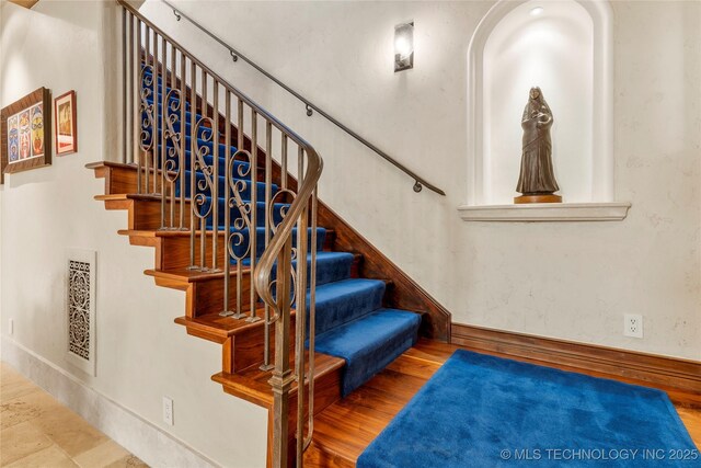 3217 E 61st Pl, Tulsa, OK 74136 - stairs with baseboards, visible vents, and wood finished floors