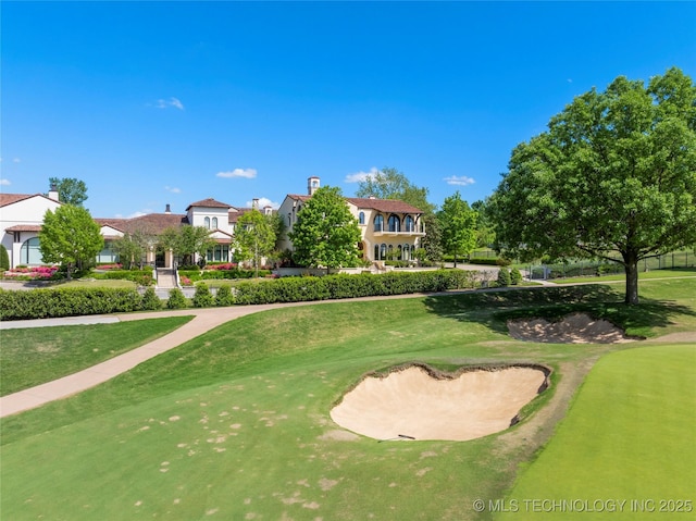 3217 E 61st Pl, Tulsa, OK 74136 - surrounding community with a lawn and golf course view