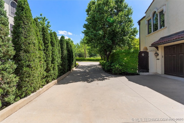3217 E 61st Pl, Tulsa, OK 74136 - exterior space with concrete driveway